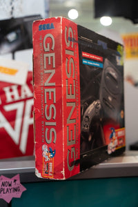 Sega Genesis console with original box, controllers, cables, and Sonic the Hedgehog 2 game cartridge, 1992