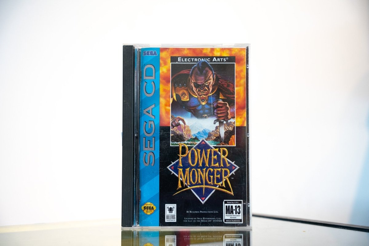Sega CD PowerMonger game complete in tall case blue spine medieval warlord armor sword village landscape gold POWER MONGER text Electronic Arts Bullfrog MA-13
