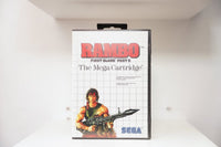 Sega Master System Rambo First Blood Part II clamshell case with illustrated Rambo holding machine gun and ammo belt, The Mega Cartridge subtitle