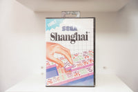 Sega Master System Shanghai clamshell case with hand selecting Mahjong tile from layered arrangement, blue Family category banner, Sega logo