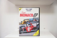 Sega Master System Super Monaco GP clamshell case with Formula 1 race cars illustration, red number 1 car, 8-Bit Cartridge banner, New badge