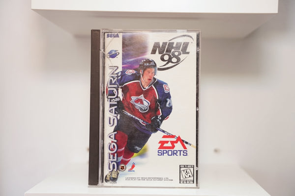 Sega Saturn NHL 98 jewel case with Colorado Avalanche player in burgundy jersey, EA Sports logo, NHL and NHLPA logos