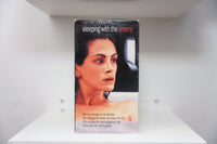 VHS Sleeping with the Enemy Julia Roberts fearful look wet hair window julia roberts sleeping with the enemy red text stranger small town tagline