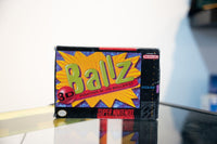 SNES Ballz 3D box with large green text bursting from orange starburst, Fighting at its Ballziest tagline, Accolade logo, purple background
