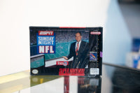 SNES ESPN Sunday Night NFL box with broadcaster at desk, stadium background, ESPN logo, Sony Imagesoft, appears sealed in shrink wrap