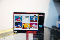 SNES Family Dog box with comic strip panels showing cartoon dog in humorous situations, Malibu Games logo, hand-drawn title text