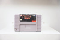 SNES Family Feud grey cartridge with red and gold Family Feud logo on dark background, GameTek logo, label wear