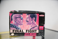 SNES Final Fight box with two tough guys face-off artwork, punk with sunglasses versus mustachioed man, Capcom USA logo, significant box wear