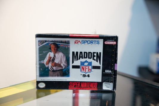 SNES Madden NFL 94 box with John Madden in headset and tie pointing, EA Sports logo, NFL shield, Licensed by Nintendo
