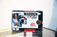 SNES Madden 96 box with John Madden in headset and football action photo, EA Sports logo, New Release gold seal, appears sealed