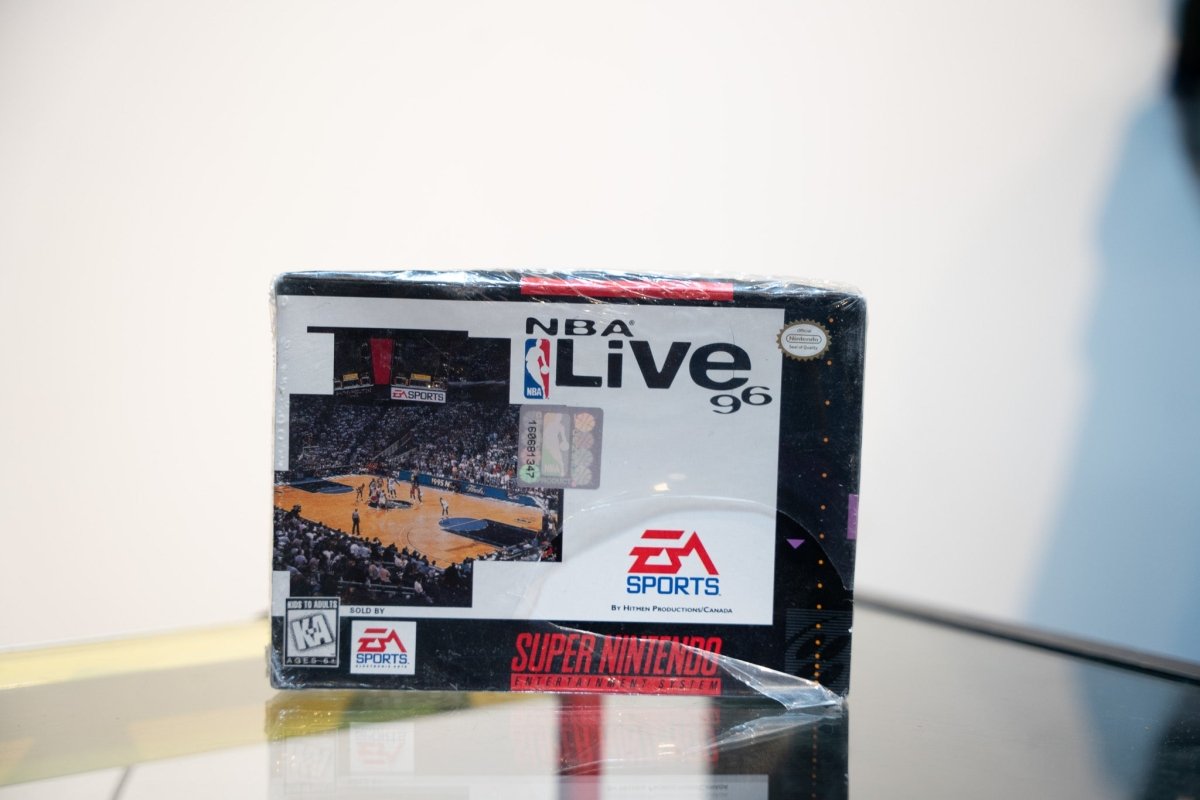 Super Nintendo NBA Live 96 box with NBA arena action photo, EA Sports logo, appears sealed in shrink wrap, Kids to Adults rating