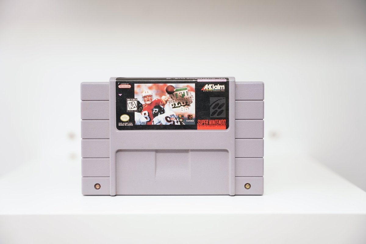 Nintendo SNES NFL Quarterback Club '96 game cartridge with black label and red text on white background