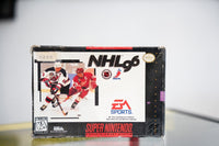 SNES NHL 96 box with New Jersey Devils and Detroit Red Wings hockey players, EA Sports logo, NHL and NHLPA logos, significant box wear