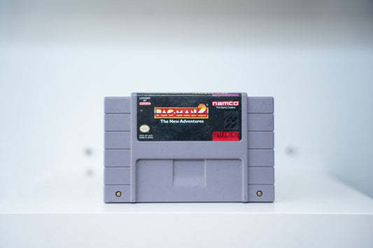 SNES Pac-Man 2 The New Adventures grey cartridge with gold and red Pac-Man 2 logo on black label, Namco The Game Creator logo
