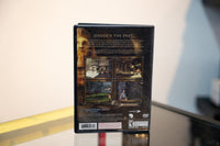 Sony PlayStation 2 Tomb Raider Anniversary game case with manual, showing cover art featuring the iconic adventure character in tropical setting