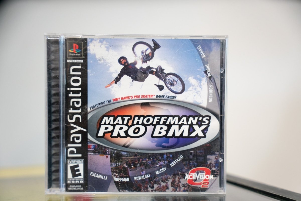 PlayStation Mat Hoffman Pro BMX black label jewel case with BMX rider aerial trick blue sky Tony Hawk Pro Skater engine text Activision