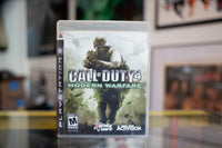 Sony PlayStation PS3 Call of Duty 4 Modern Warfare game case with black cover art and disc visible through clear plastic
