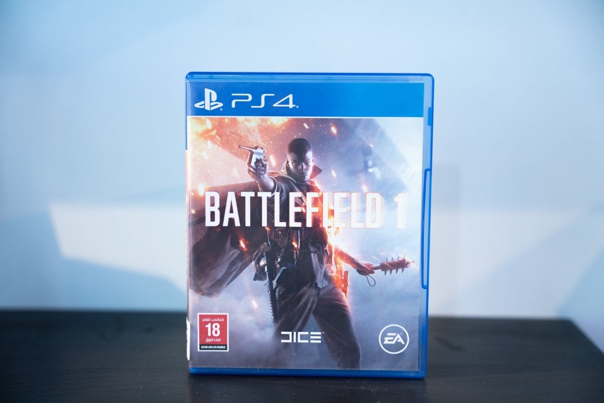 PS4 Battlefield 1 blue case WWI soldier holding pistol and melee weapon explosions fire BATTLEFIELD 1 white text DICE EA