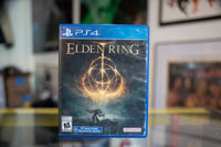 PlayStation Elden Ring PS4 game case with cover art showing a golden figure against a dark background, 2022