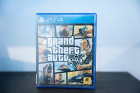 PS4 Grand Theft Auto V blue case classic multi-panel comic-style cover art characters action scenes grand theft auto V white text Rockstar Games Mature