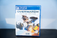 PS4 Overwatch Origins Edition blue case Tracer dynamic pose dual pistols goggles flight suit OVERWATCH white text Blizzard Teen rating