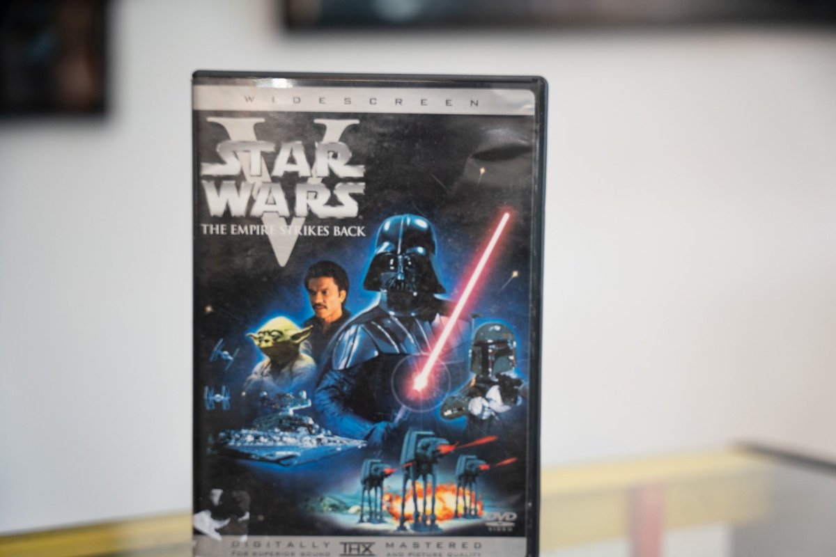 Star Wars The Empire Strikes Back DVD widescreen with Darth Vader red lightsaber Lando Yoda Boba Fett AT-ATs Star Destroyer dark tones THX