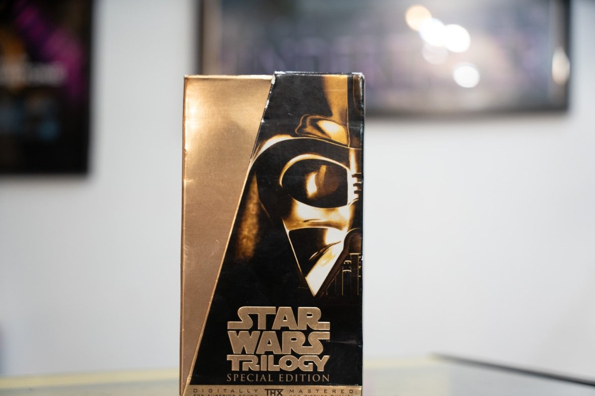 Star Wars Trilogy Special Edition VHS gold box set with close-up Darth Vader helmet in gold bronze tones white STAR WARS TRILOGY lettering and THX badge