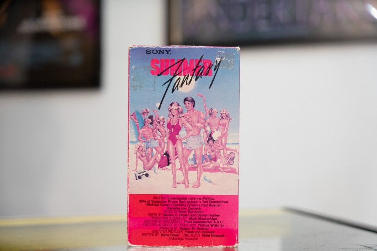 Pink and blue Summer Fantasy VHS with illustrated beach party scene red SUMMER Fantasy title Sony Video release and Julianne Phillips starring credit
