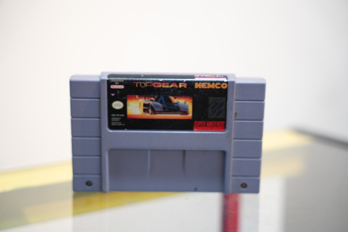 SNES Top Gear gray cartridge dark race car flames TOP GEAR text KEMCO publisher Nintendo Super Nintendo