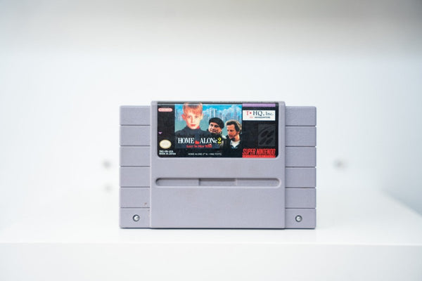 Super Nintendo Home Alone 2 Lost in New York gray SNES cartridge Kevin McCalister Wet Bandits NYC skyline label THQ