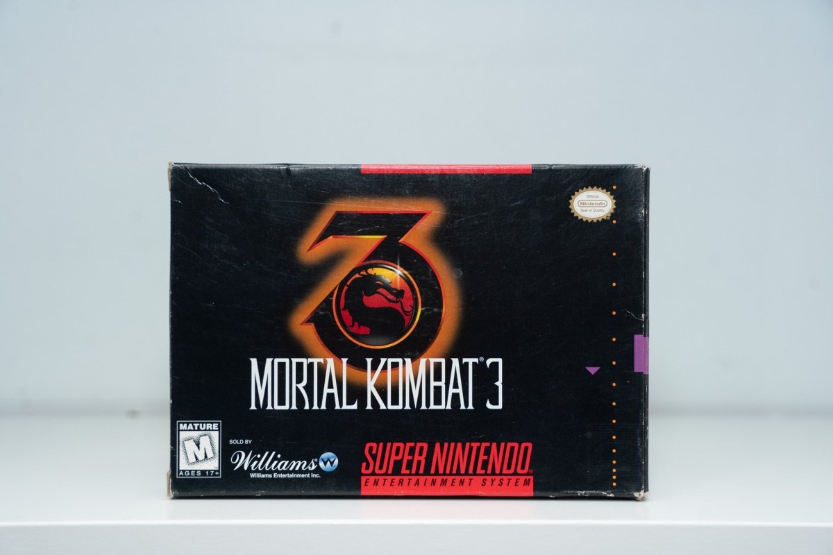 Super Nintendo Mortal Kombat 3 box black background metallic 3 with dragon logo orange gold MORTAL KOMBAT 3 silver text Williams Mature
