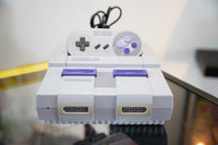 Super Nintendo Entertainment System SNES console gray purple with original controller power reset switches two controller ports
