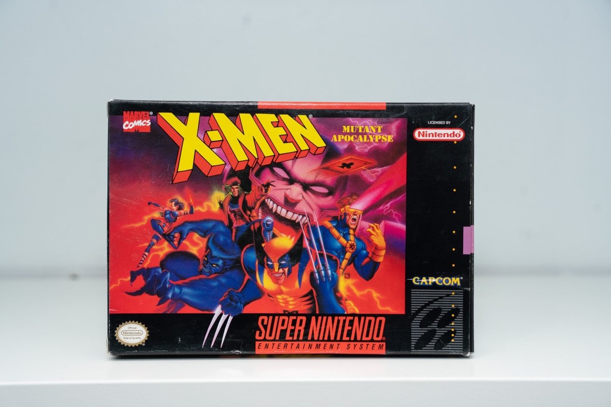 Super Nintendo X-Men Mutant Apocalypse box Wolverine claws Psylocke Beast Cyclops Gambit Apocalypse face X-MEN yellow logo Capcom Marvel