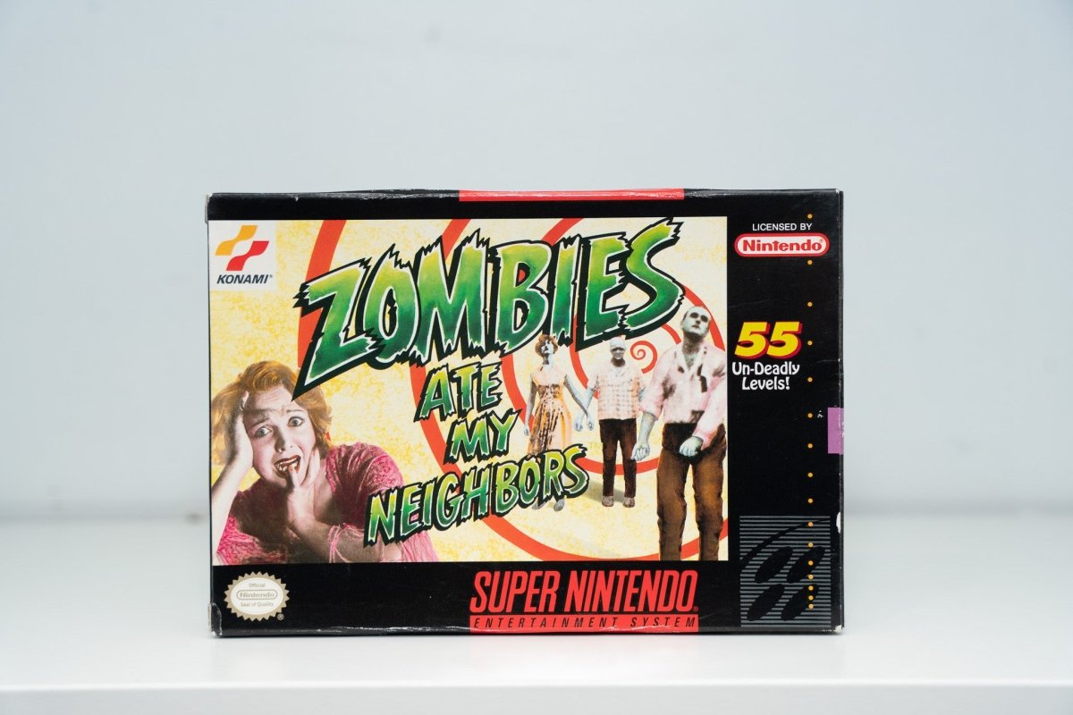 Super Nintendo Zombies Ate My Neighbors box screaming woman zombies red vortex green ZOMBIES dripping text 55 Un-Deadly Levels Konami