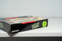 Nintendo Super Nintendo Zombies At My Neighbors complete in box cartridge with manual and case, 1990s era game displayed against white background