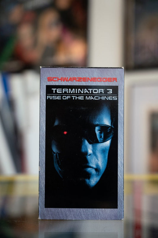 Terminator 3 Rise of the Machines VHS in metallic slipcase with blue-toned Arnold Schwarzenegger half-face endoskeleton with red eye