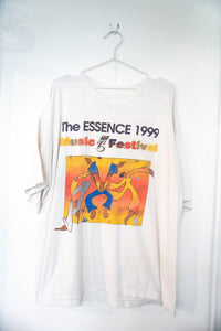 White 1999 Essence Music Festival 5th Anniversary tee with colorful illustrated dancing figures sunset gradient rainbow Music Festival text size XL