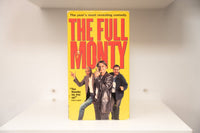 The Full Monty VHS cover with three cast members on yellow background, large red title text, zipper graphic, and Siskel & Ebert quote