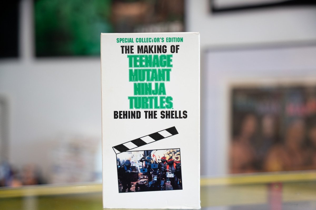VHS tape of "The Making Of The Teenage Mutant Ninja Turtles Behind The Shells" documentary, showing the VHS cover with artwork and text on spine and front