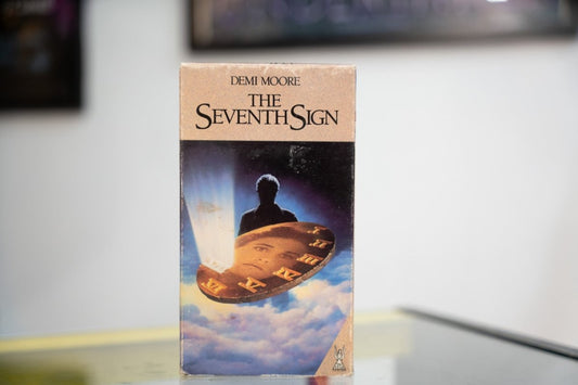 The Seventh Sign VHS tan sleeve with Demi Moore credit silhouetted figure divine light golden disc with Roman numerals in clouds