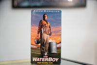 The Waterboy VHS blue sky sleeve with Adam Sandler in plaid shirt orange vest water bottles football field sunset white red title High Quality H2O tagline