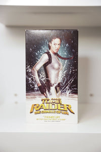 VHS Lara Croft Tomb Raider Cradle of Life Angelina Jolie silver wetsuit water dual pistols TOMB RAIDER gold text Ebert quote Paramount