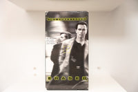 VHS Eraser dark cover Schwarzenegger suit Vanessa Williams blurred crosshair SCHWARZENEGGER yellow green text ERASER Warner Bros