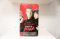 VHS Hard to Kill red black cover Steven Seagal handgun leather jacket Kelly LeBrock Hard To Kill white red text Warner Bros