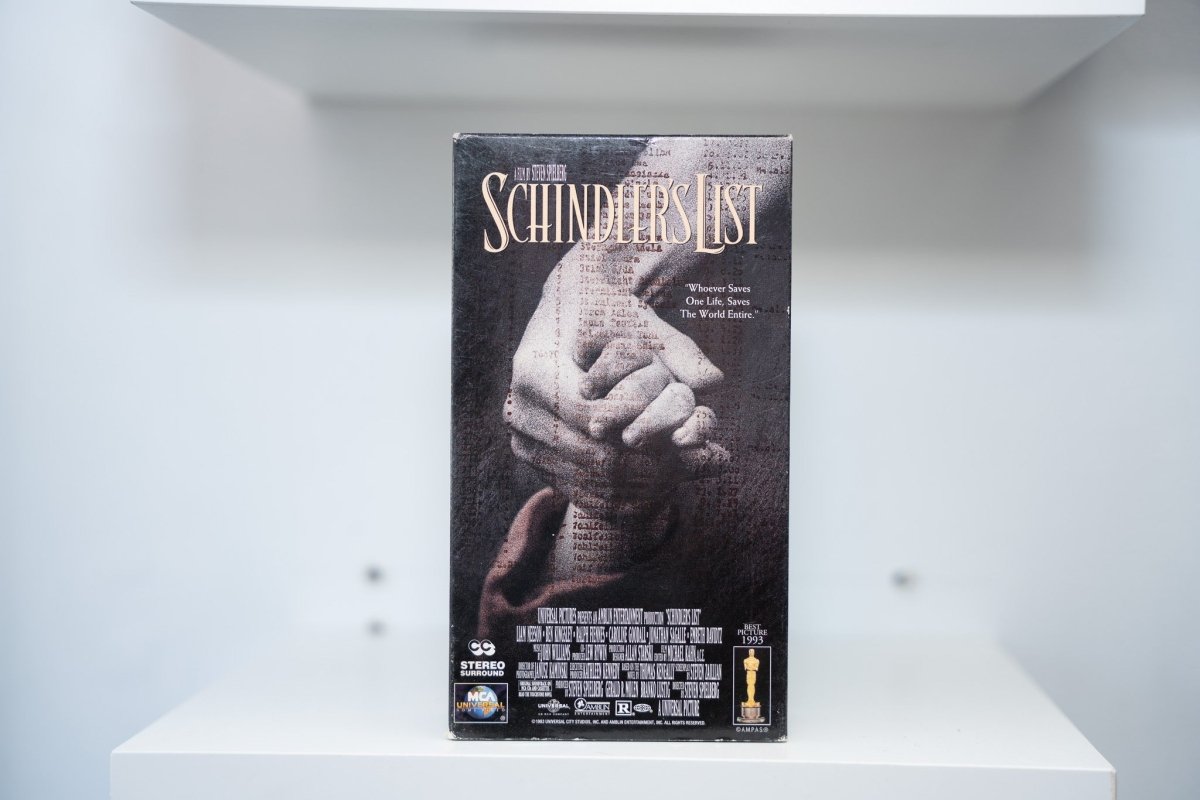 VHS Schindler's List dark cover clasped hands typewritten list background SCHINDLER'S LIST silver text Steven Spielberg Best Picture 1993 Oscar MCA