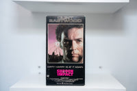 VHS Sudden Impact black cover CLINT EASTWOOD silver text face close-up shattered glass bullet hole city skyline SUDDEN IMPACT pink text Warner Bros