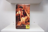 VHS The Pelican Brief amber sepia cover Denzel Washington Julia Roberts Capitol dome newspaper headlines THE PELICAN BRIEF white text Previously Viewed