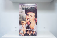 VHS The Wheeler Dealers painted cover James Garner cowboy hat red telephone Lee Remick elegant dress THE WHEELER DEALERS white text MGM/UA