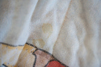 WWF 1980s wrestling comforter featuring Hulk Hogan, Roddy Piper, Junk Yard Dog, and The Sheik printed on fabric with visible wear