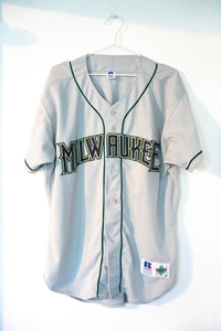 Gray vintage 90s Russell Athletic Diamond Collection Milwaukee Brewers away button-front baseball jersey dark green MILWAUKEE lettering gold outline piping size 48